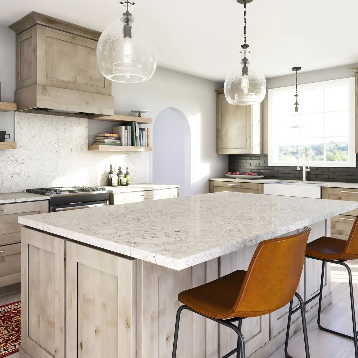 White quartz kitchen island and perimeter countertops with light veining and clean edges — premium stone countertops installed by Signature Stone Las Vegas
