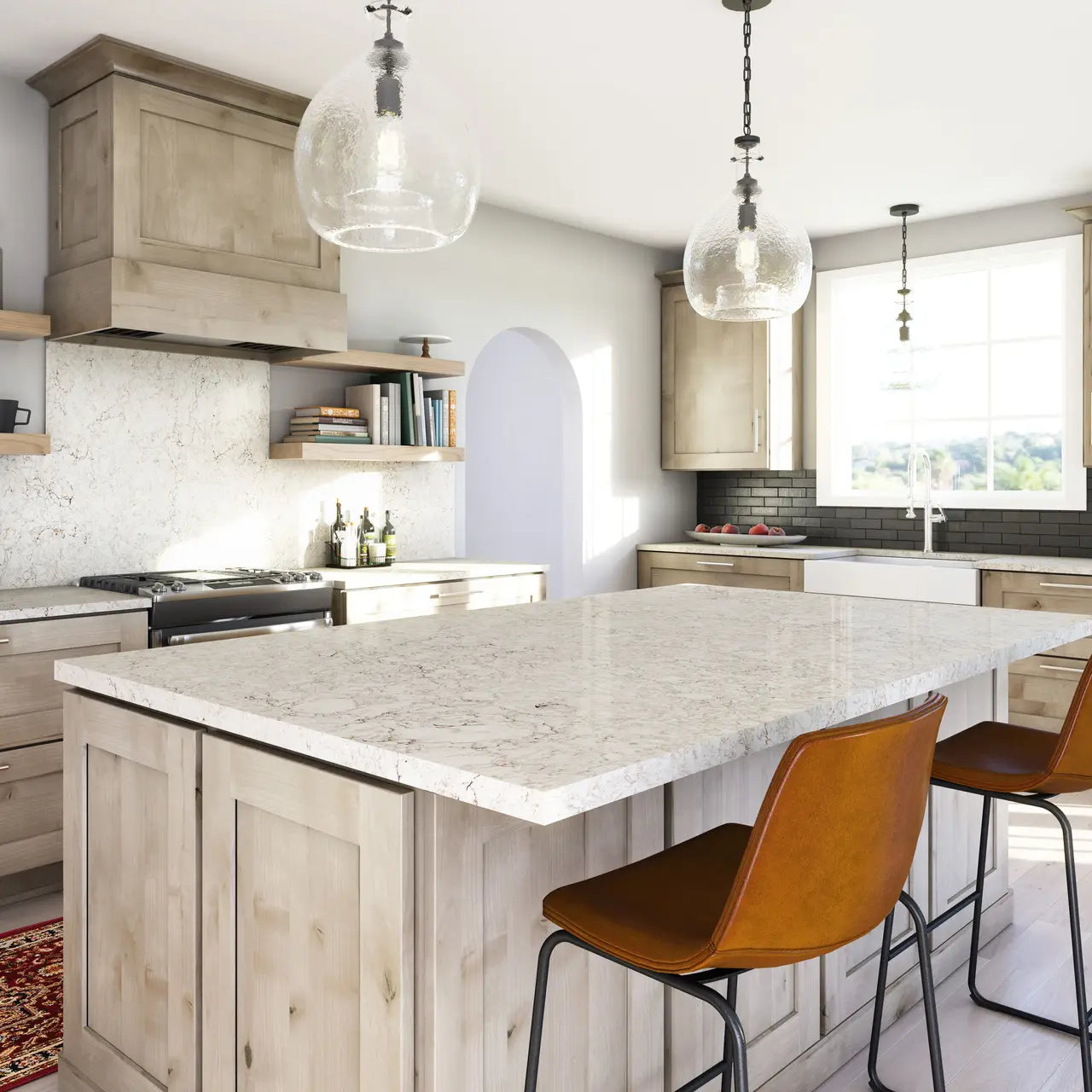 White quartz kitchen island and perimeter countertops with light veining and clean edges — premium stone countertops installed by Signature Stone Las Vegas