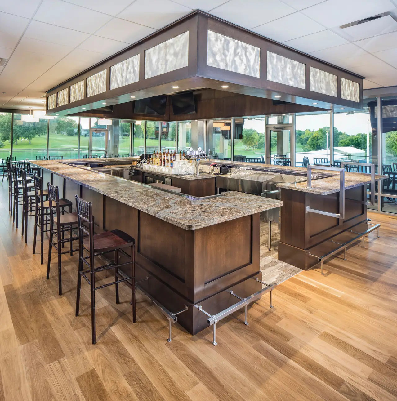 Granite bar countertops with speckled pattern and polished finish in modern restaurant — premium stone countertops installed by Signature Stone Las Vegas