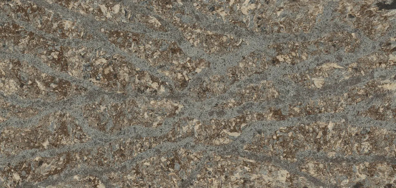 Granite surface with speckled gray and beige pattern showing natural stone texture — professional countertop fabrication by Signature Stone Las Vegas