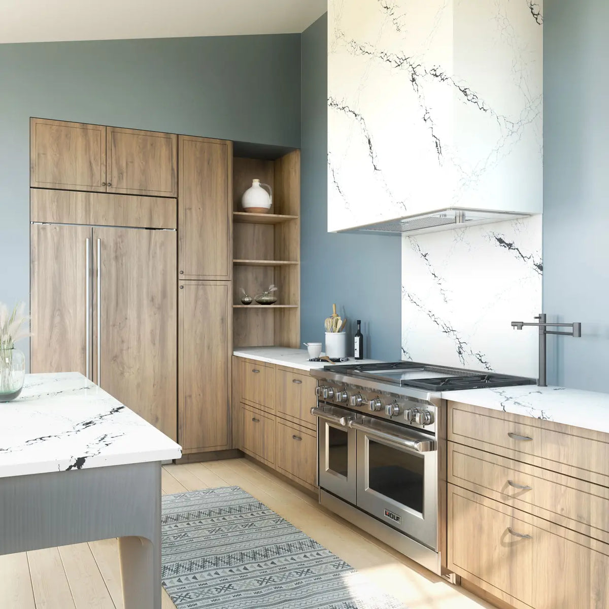 Quartz kitchen countertops with white marble veining and waterfall edge — premium stone countertops installed by Signature Stone Las Vegas