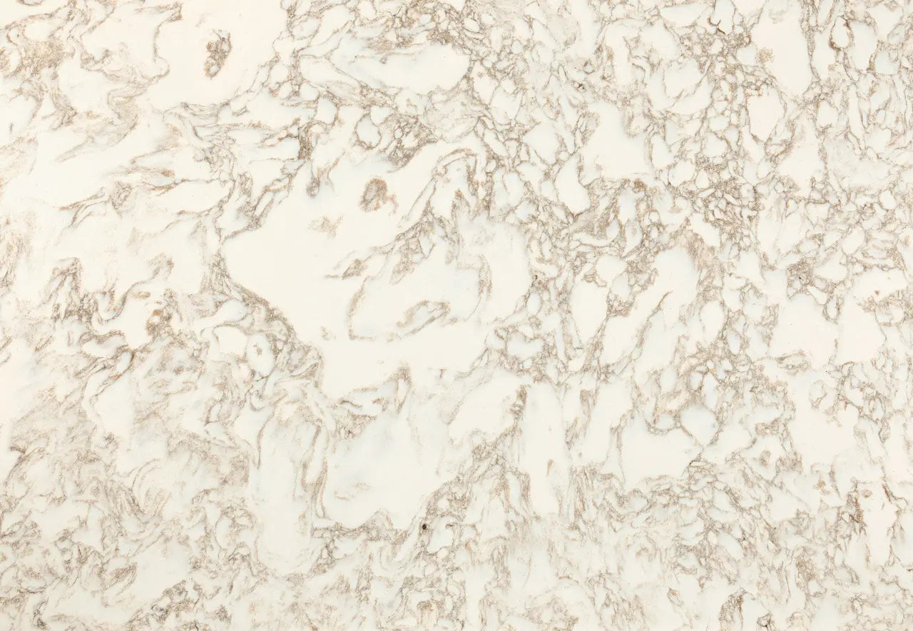 Hermitage quartz surface with creamy white background and delicate beige veining throughout — ideal for custom countertops fabricated and installed by Signat...