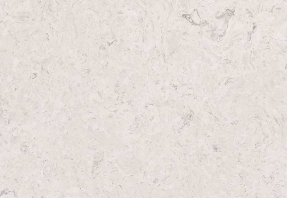 Highgate quartz surface with soft white background and subtle gray veining in polished finish — custom countertops fabricated and installed by Signature Ston...