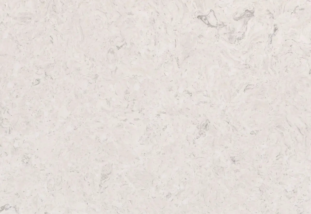 Highgate quartz surface with soft white background and subtle gray veining in polished finish — custom countertops fabricated and installed by Signature Ston...