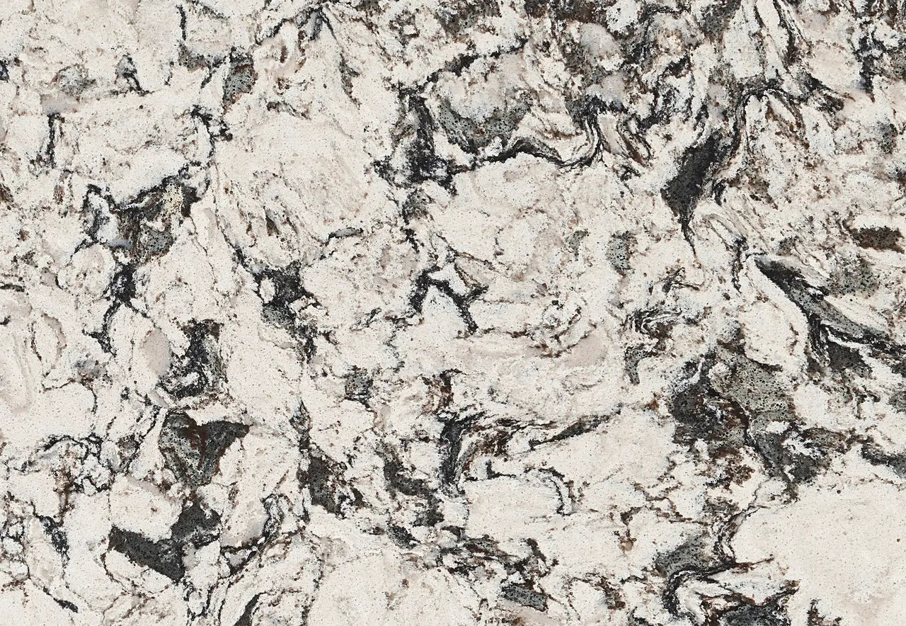 Huntley quartz surface with creamy beige base and dramatic charcoal veining — custom countertops fabricated and installed by Signature Stone LV