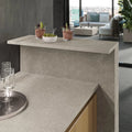 Boost Mineral Grey quartz kitchen island with smooth matte finish and straight edges — premium stone countertops installed by Signature Stone Las Vegas