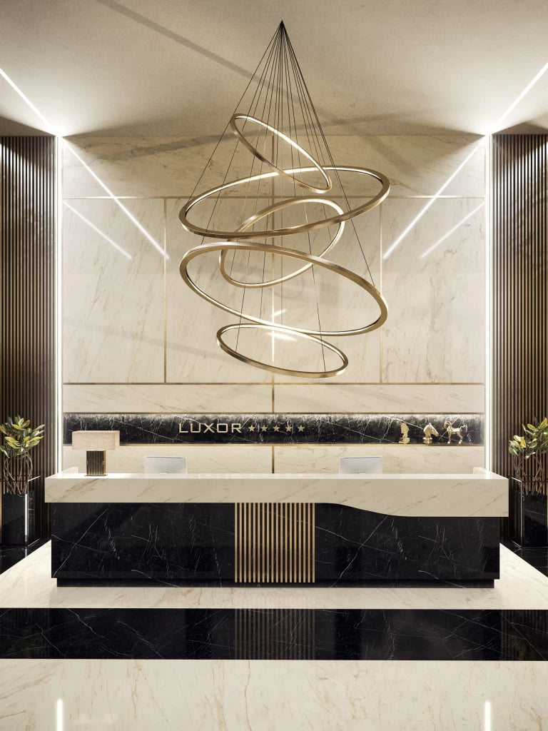 Cremo Delicato marble reception desk with white veined finish and black accents — luxury stone countertops installed by Signature Stone Las Vegas