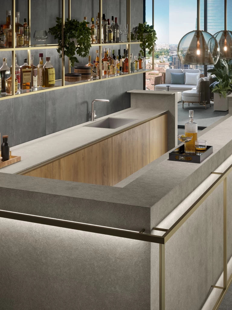 Boost Mineral Grey kitchen island with integrated sink and smooth matte finish — custom countertops fabricated and installed by Signature Stone LV