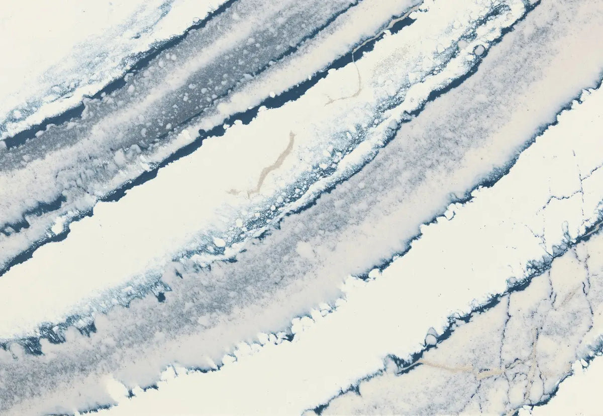 Inverness Bristol Bay quartz slab with flowing blue and white veining and polished finish — ideal for custom countertops fabricated and installed by Signatur...