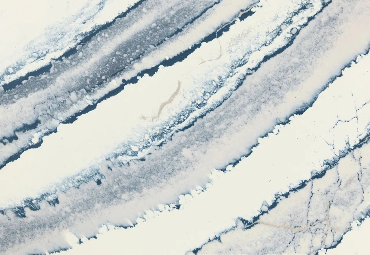 Inverness Bristol Bay quartz slab with flowing blue and white veining and polished finish — ideal for custom countertops fabricated and installed by Signatur...