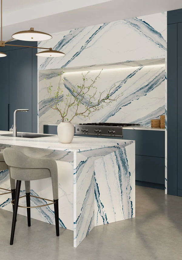 Inverness Bristol Bay quartz kitchen island with dramatic blue-gray veining and waterfall edge — premium stone countertops installed by Signature Stone Las V...