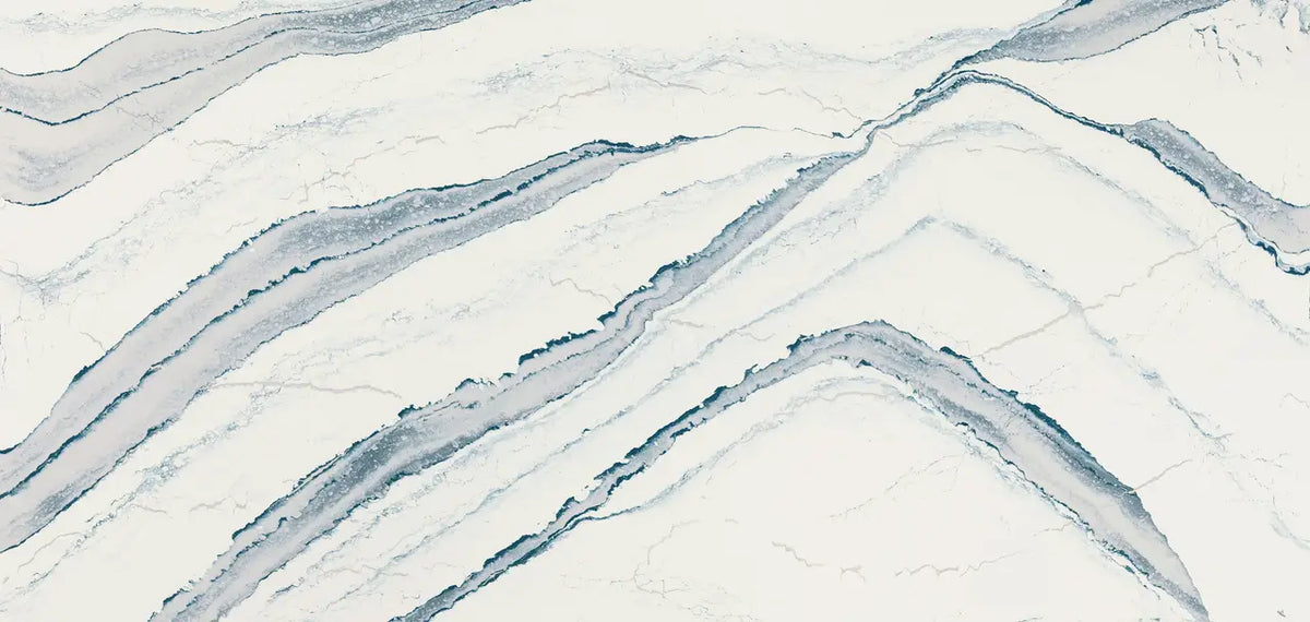 Inverness Bristol Bay quartz surface with flowing blue-gray veining and polished finish — custom countertops fabricated and installed by Signature Stone LV