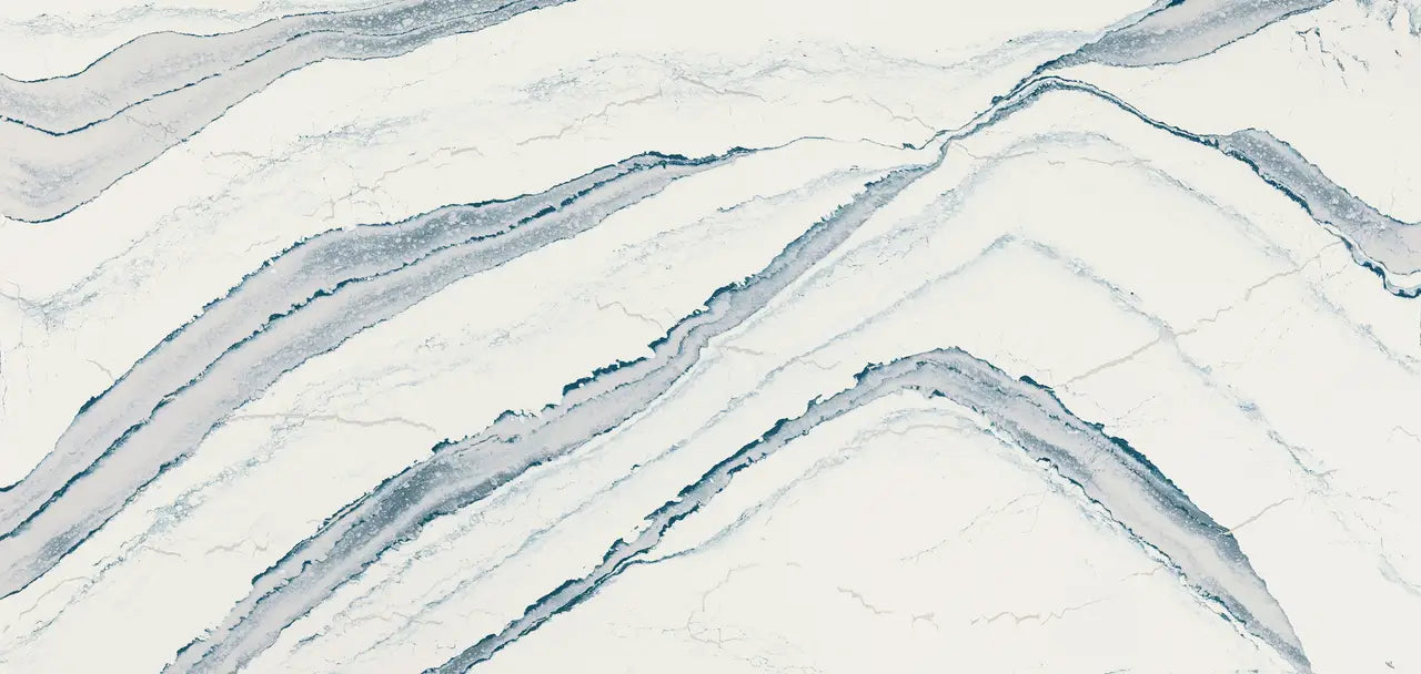 Inverness Bristol Bay quartz surface with flowing blue-gray veining and polished finish — custom countertops fabricated and installed by Signature Stone LV