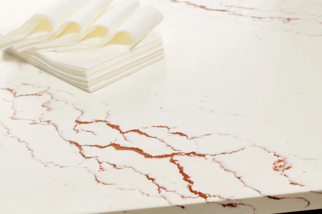 Inverness Bronze quartz surface with white base and bronze veining — elegant custom countertops fabricated and installed by Signature Stone LV