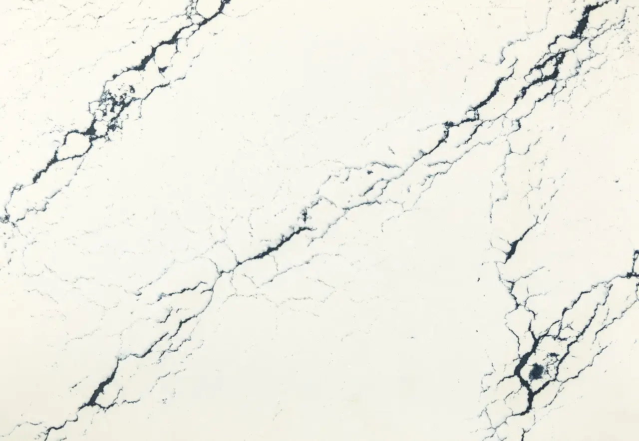 Inverness Cobalt quartz slab with cream base and bold navy blue veining — premium countertop fabrication by Signature Stone Las Vegas