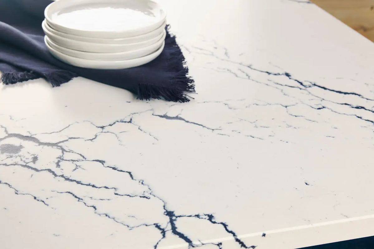 Inverness Cobalt quartz slab with white base and bold blue veining — custom countertops fabricated and installed by Signature Stone LV