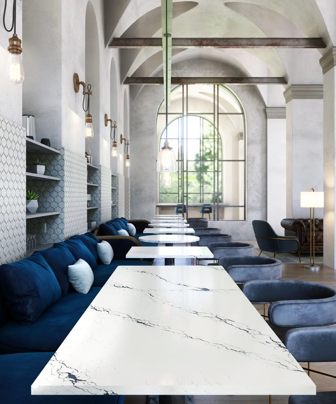 Inverness Cobalt quartz dining tables with white marble-look veining and clean edges — elegant custom countertops fabricated and installed by Signature Stone LV