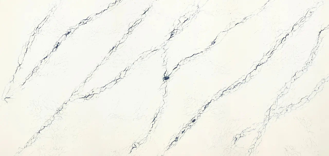 Inverness Cobalt quartz slab with white base and diagonal blue veining — premium stone countertops installed by Signature Stone Las Vegas