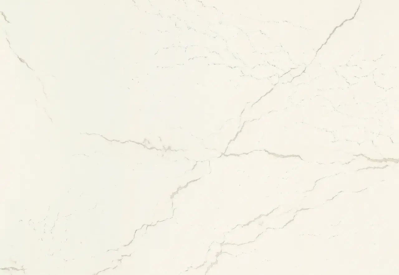 Inverness Frost quartz surface with soft white background and delicate gray veining — custom countertops fabricated and installed by Signature Stone LV