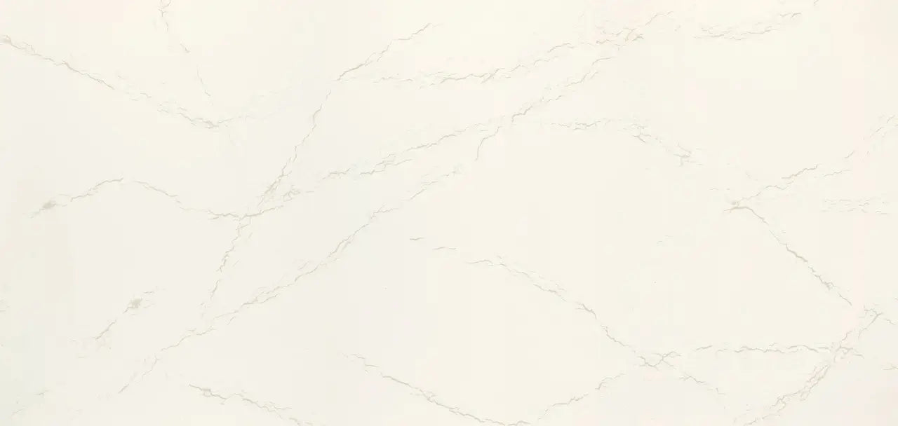 Inverness Frost quartz slab with subtle white base and delicate gray veining — custom countertops fabricated and installed by Signature Stone LV