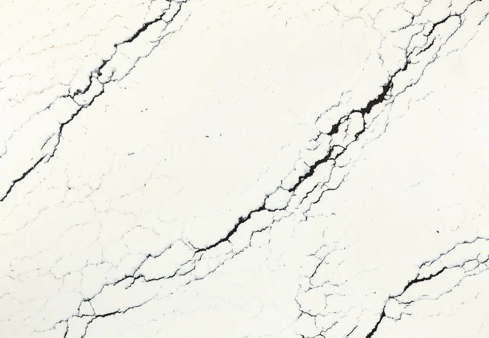 Inverness Platinum quartz slab with creamy white base and bold black veining — elegant custom countertops fabricated and installed by Signature Stone LV