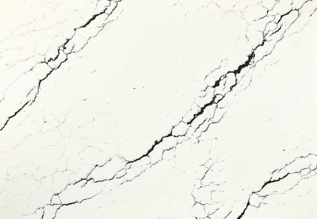 Inverness Platinum quartz slab with creamy white base and bold black veining — elegant custom countertops fabricated and installed by Signature Stone LV