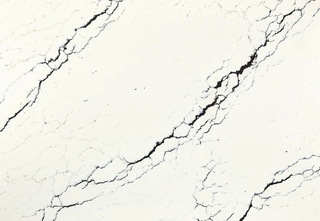 Inverness Platinum quartz slab with creamy white base and bold black veining — elegant custom countertops fabricated and installed by Signature Stone LV
