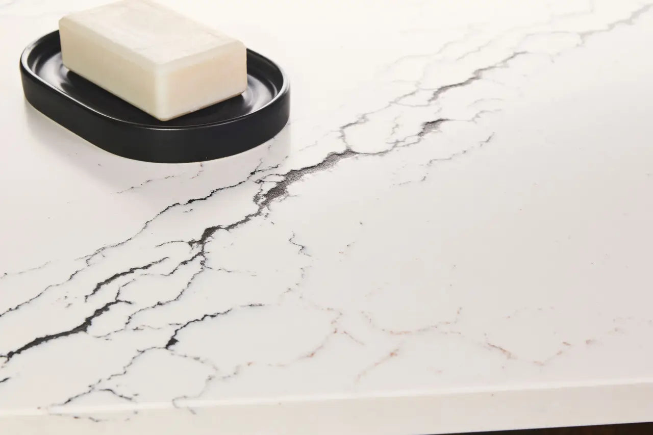 Inverness Platinum quartz surface with white base and gray veining featuring black soap dish — elegant stone countertops installed by Signature Stone Las Vegas
