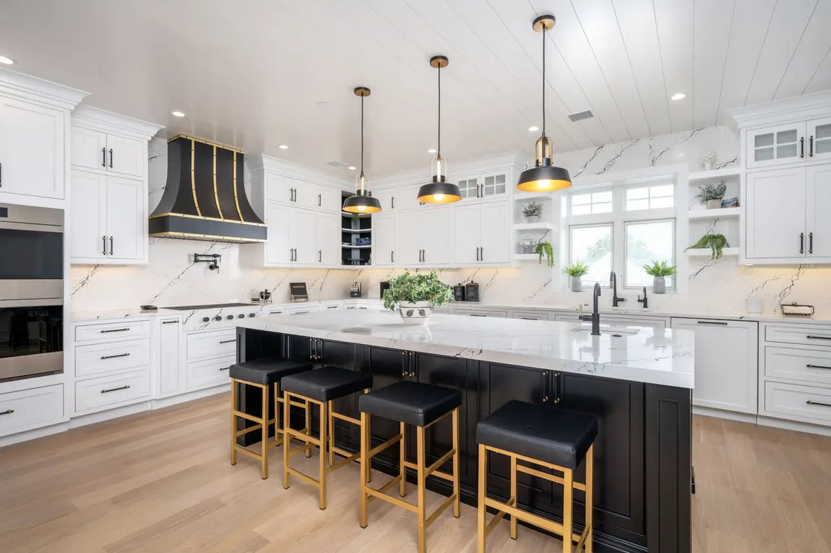 Inverness Platinum quartz kitchen island and perimeter countertops with white veining and polished finish — premium countertop fabrication by Signature Stone...