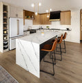 Inverness Platinum quartz kitchen island with white marble-look veining and waterfall edge — premium stone countertops installed by Signature Stone Las Vegas