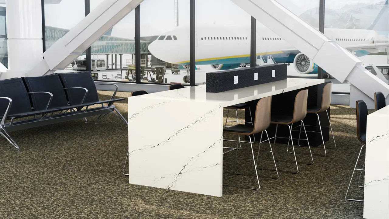 Inverness Platinum quartz table surface with white marble-look veining and clean edges — custom countertops fabricated and installed by Signature Stone LV