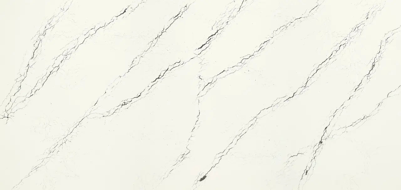 Quartz slab surface featuring elegant white base with gray diagonal veining and polished finish — premium stone countertops installed by Signature Stone Las ...