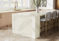 Inverness Swansea quartz kitchen island with white marble veining and waterfall edge — elegant stone countertops installed by Signature Stone Las Vegas