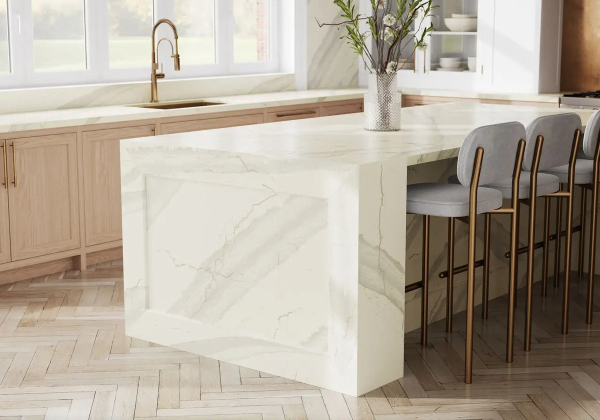 Inverness Swansea quartz kitchen island with white marble veining and waterfall edge — elegant stone countertops installed by Signature Stone Las Vegas