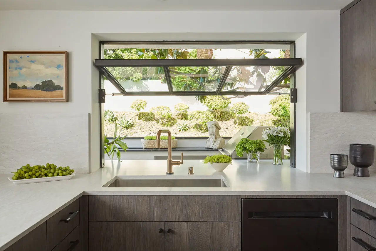 Ironsbridge quartz kitchen countertops with clean white finish and integrated undermount sink — custom countertops fabricated and installed by Signature Ston...