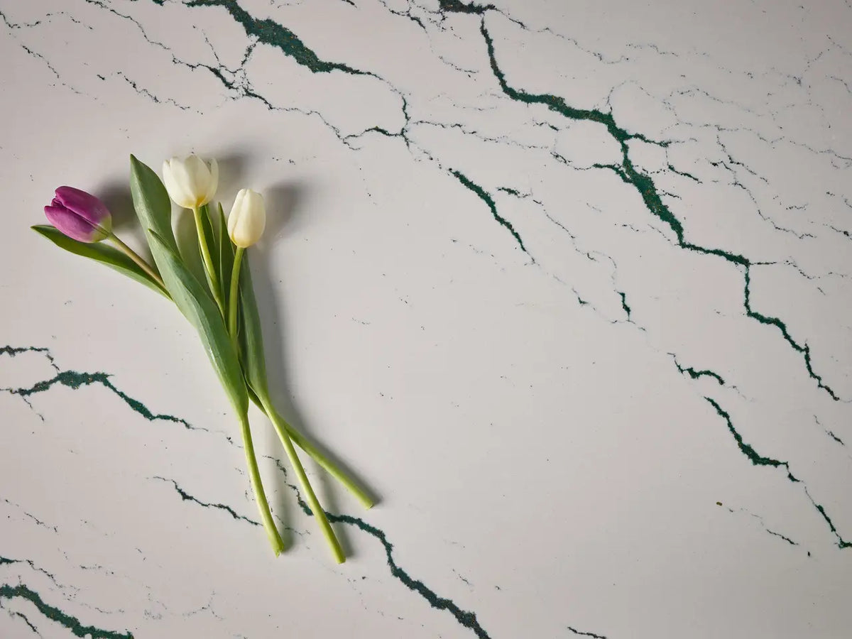 Ivybridge quartz surface with white base and green veining pattern — elegant custom countertops fabricated and installed by Signature Stone LV