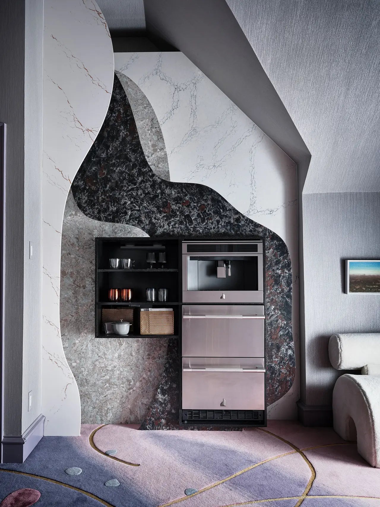 Marble kitchen niche with curved black and white veining patterns and built-in appliances — elegant stone countertops installed by Signature Stone Las Vegas