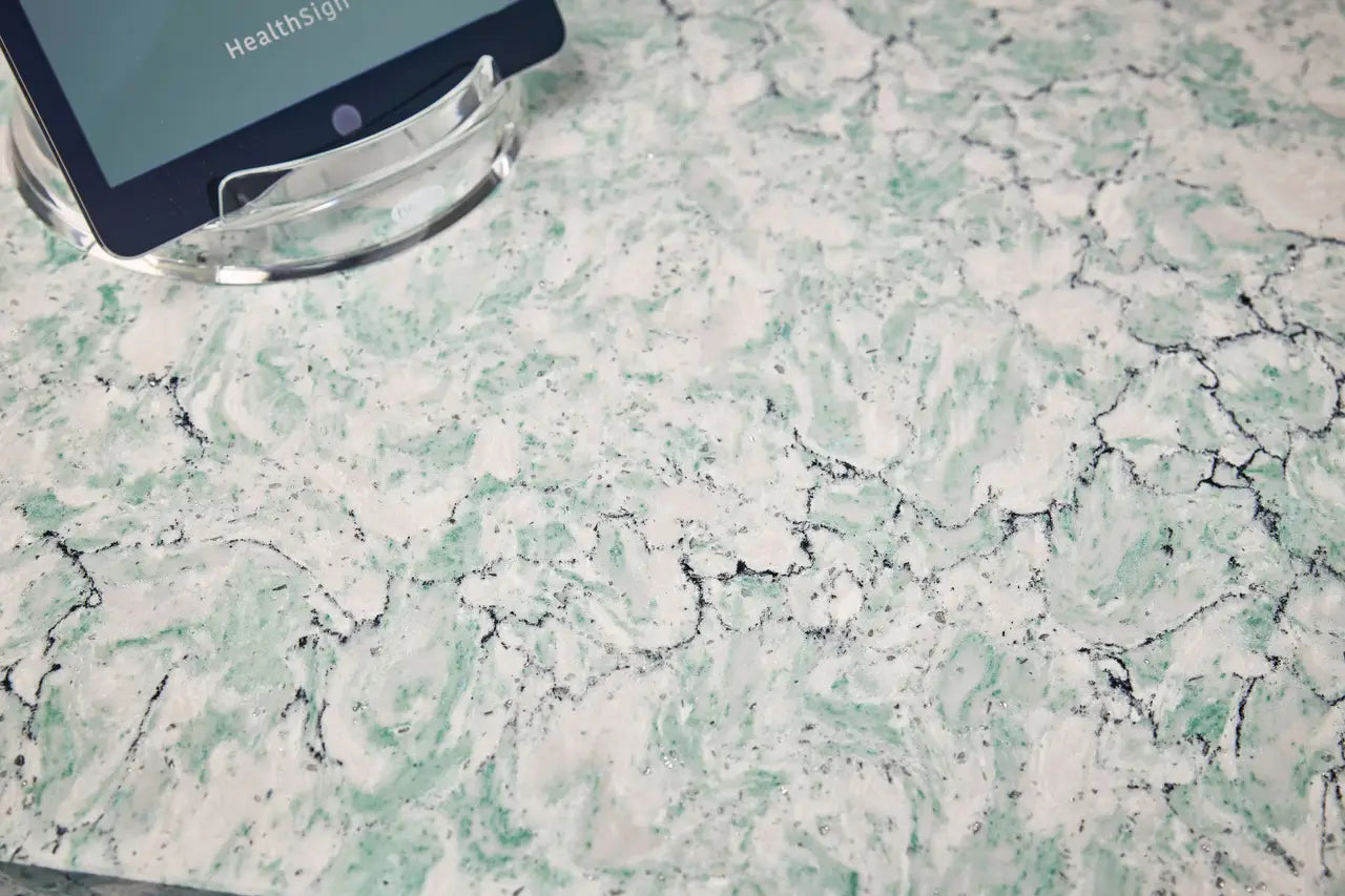 Kendal marble surface with green and white veining and black cracks — premium stone countertops installed by Signature Stone Las Vegas