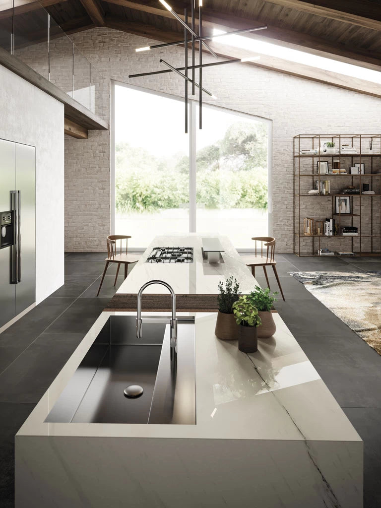Bianco Dolomite kitchen island with integrated sink featuring white marble veining and polished finish — custom countertops fabricated and installed by Signa...