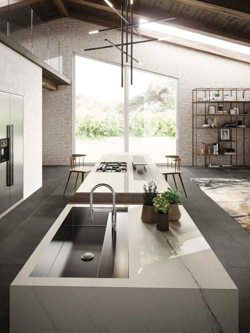 Bianco Dolomite kitchen island with integrated sink featuring white marble veining and polished finish — custom countertops fabricated and installed by Signa...