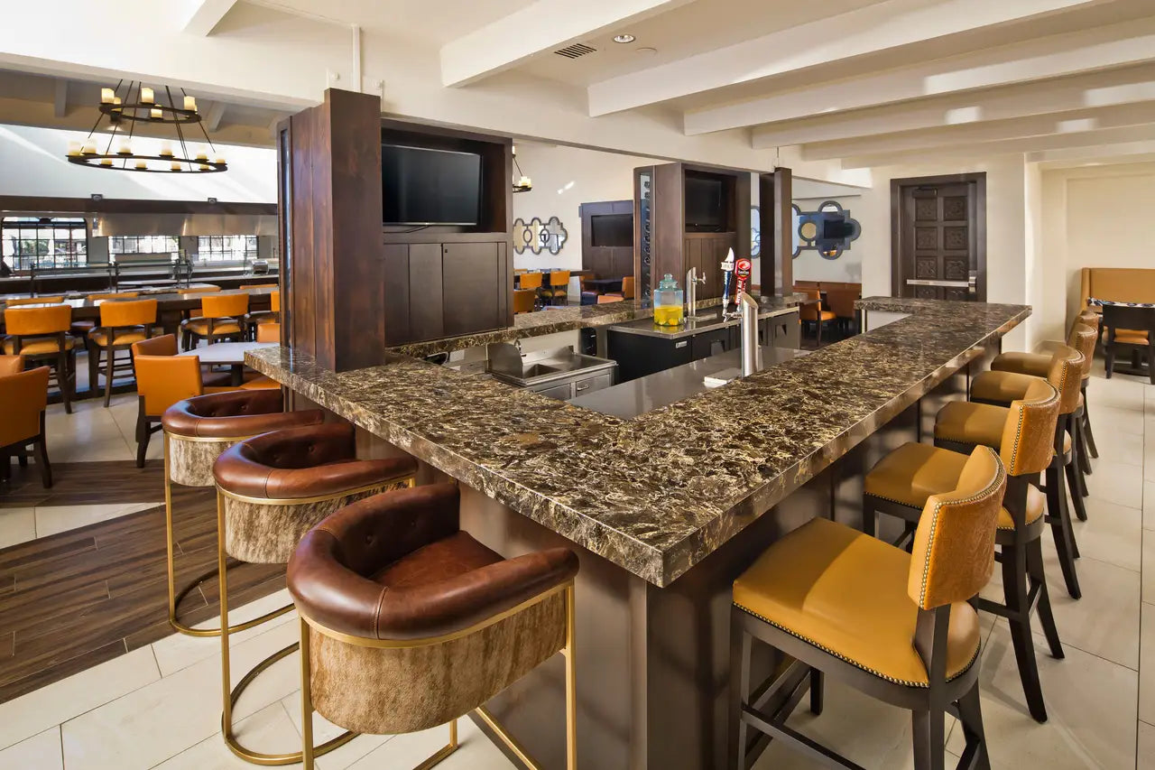 Laneshaw granite bar countertop with rich brown veining and polished finish — premium stone countertops installed by Signature Stone Las Vegas