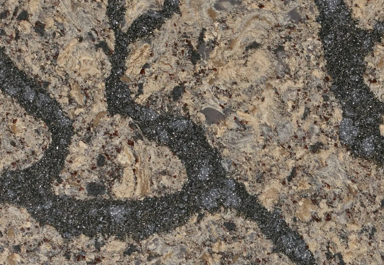 Langdon granite surface featuring beige and cream tones with dark speckled veining — ideal for custom countertops fabricated and installed by Signature Stone LV