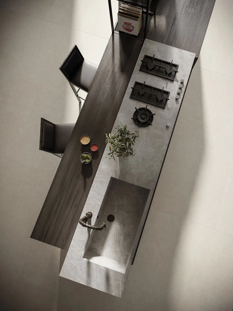 Light grey stone kitchen island with integrated sink featuring smooth matte finish — custom countertops fabricated and installed by Signature Stone LV