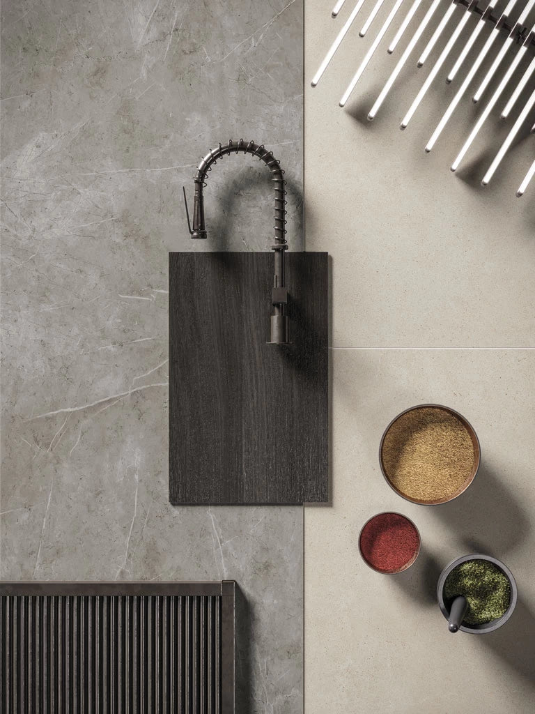 Light grey stone kitchen island with dark wood sink and modern faucet — premium stone countertops installed by Signature Stone Las Vegas