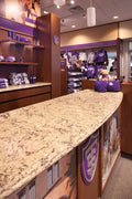 Granite retail counter with speckled beige and brown pattern and polished finish — premium stone countertops installed by Signature Stone Las Vegas