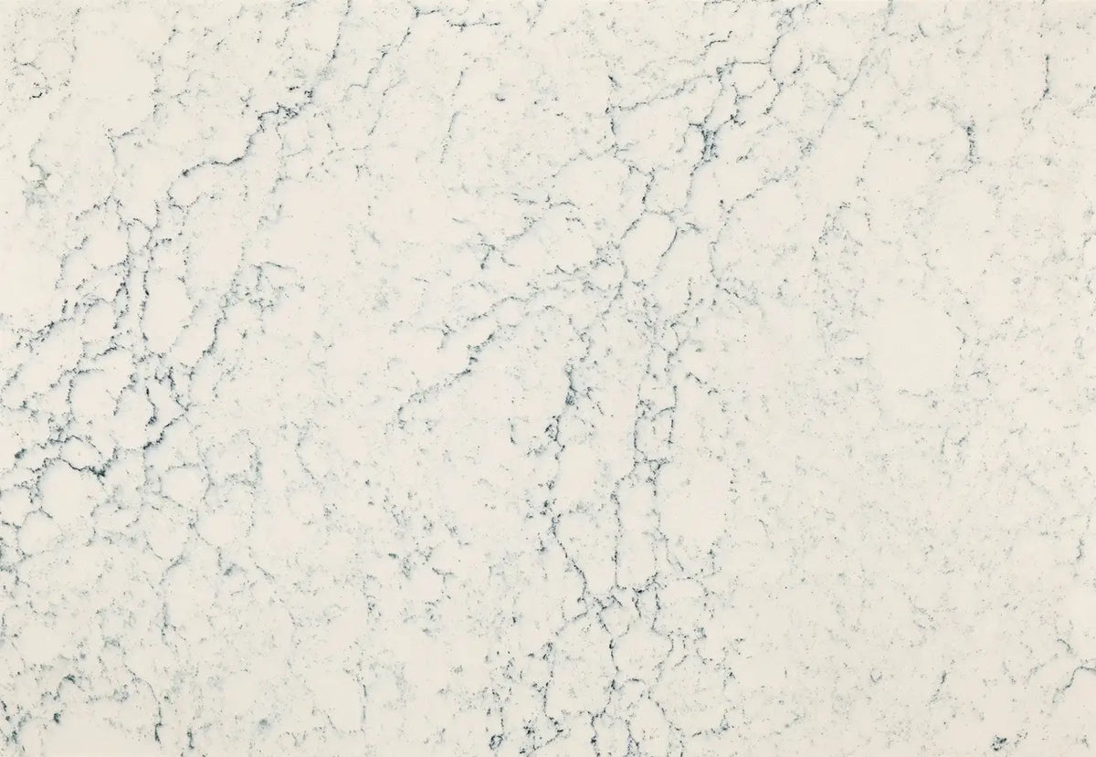 Mackworth quartz surface with soft white background and delicate gray veining — custom countertops fabricated and installed by Signature Stone LV