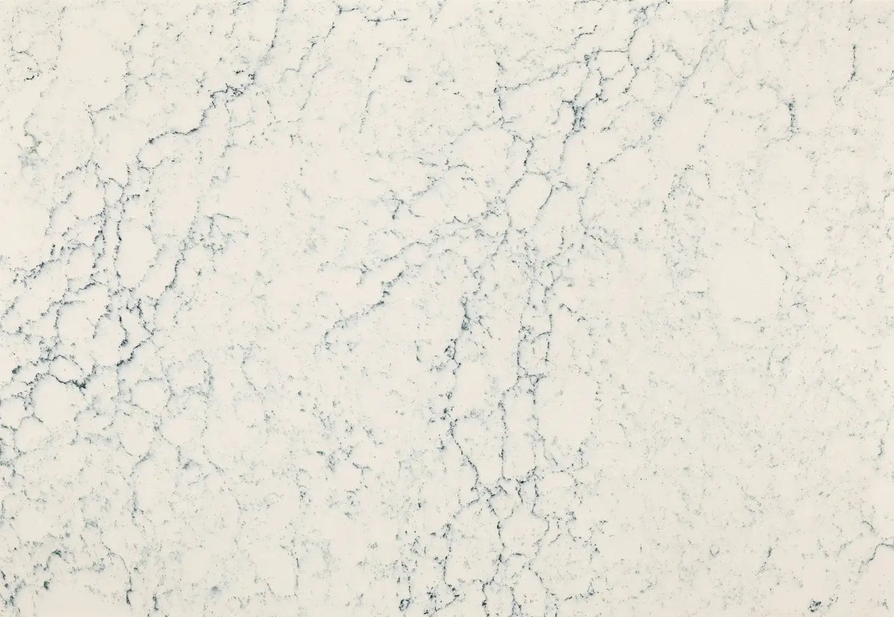 Mackworth quartz surface with soft white background and delicate gray veining — custom countertops fabricated and installed by Signature Stone LV