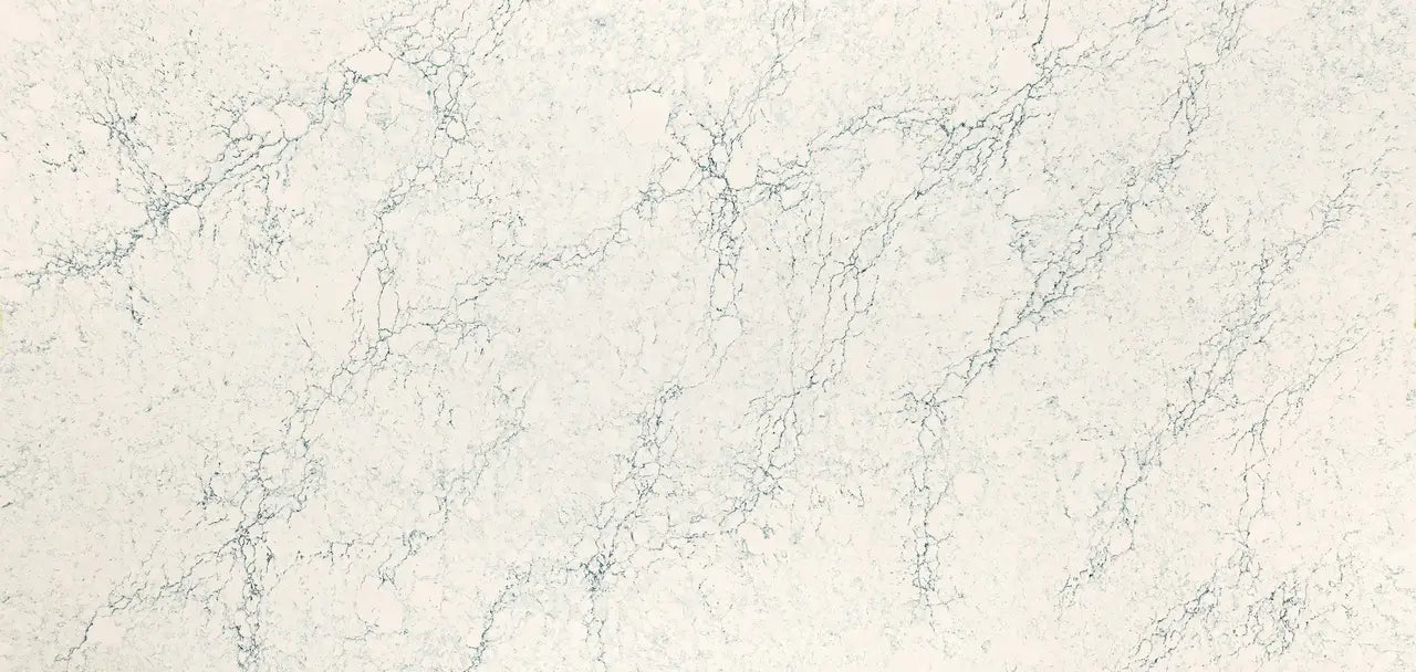 Quartz surface with subtle cream background and delicate gray veining pattern — premium countertop fabrication by Signature Stone Las Vegas