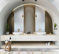 Natural stone bathroom vanity with white marble countertop and curved archway design — premium stone countertops installed by Signature Stone Las Vegas