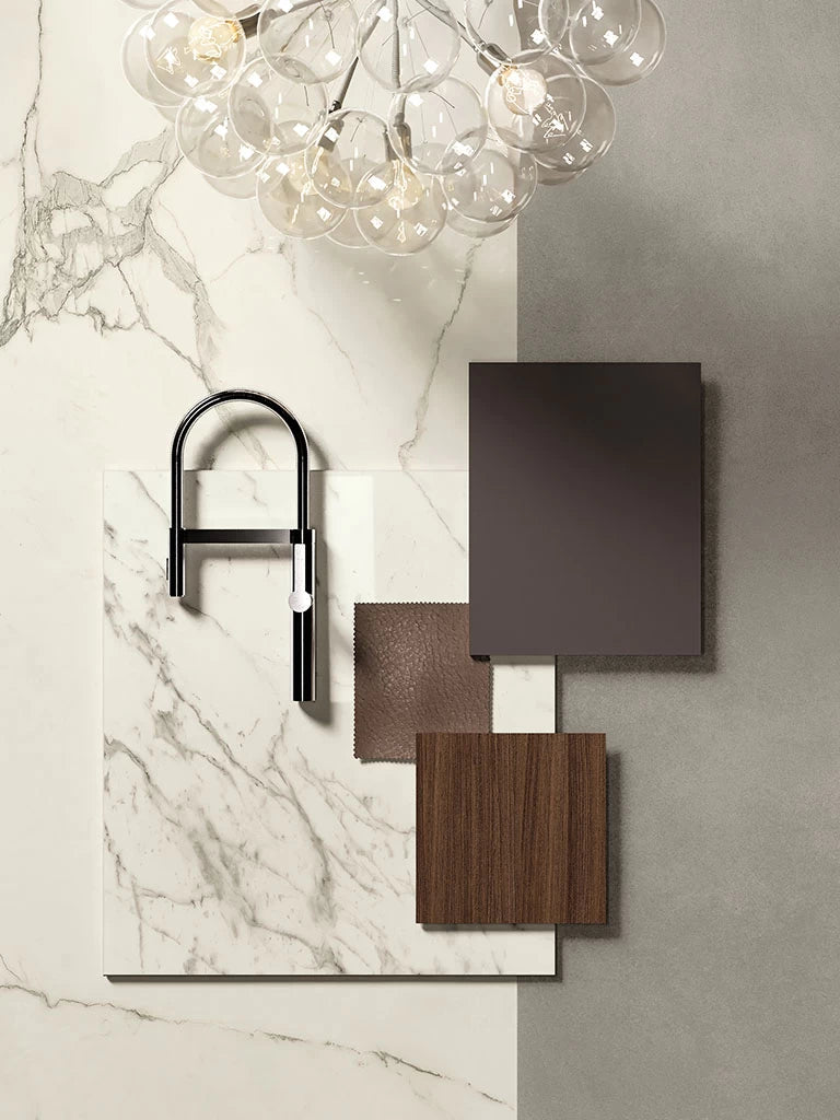 Calacatta Extra marble surface with gray veining and modern black faucet — custom countertops fabricated and installed by Signature Stone LV